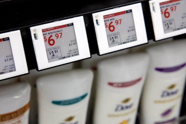A digital shelf label displays a digital, not paper, price of Dove personal care products.