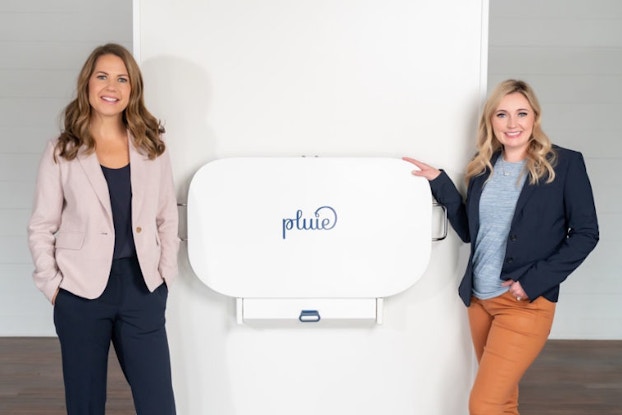 A photo of changing station company Pluie co-founders, Brittany Hizer and Addie Gundry, who are featured with their product.