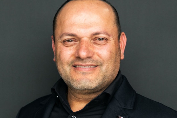 A headshot of Temoc Morfin, Founder and CEO of Cilantro Taco Grill.