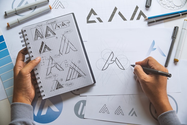 Overhead view of artist developing a logo design